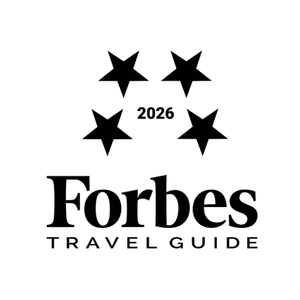 Stars and "2026" above the "Forbes Travel Guide" logo.